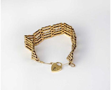 A 9ct yellow gold five bar gate bracelet with heart-shaped padlock clasp, approx. 24g.