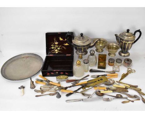 A four-piece silver plated tea service with circular plated tray with pierced border, six dressing table bottles with silver 