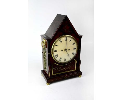 A Regency rosewood and brass inlaid lancet-shaped twin fusee bracket clock, the white enamelled dial set with Roman numerals,
