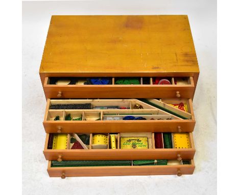MECCANO; a four-drawer chest containing vintage and contemporary Meccano pieces, various colours, and a quantity of related h