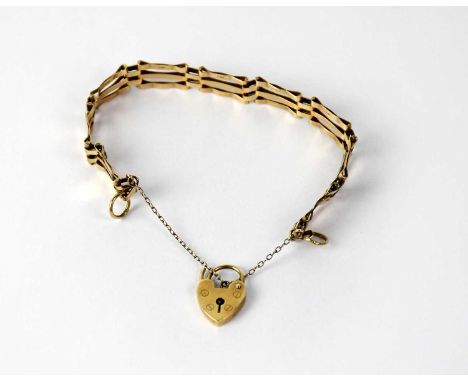 A 9ct gold three bar gate bracelet with padlock clasp, stamped 375, approx. 8.42g.