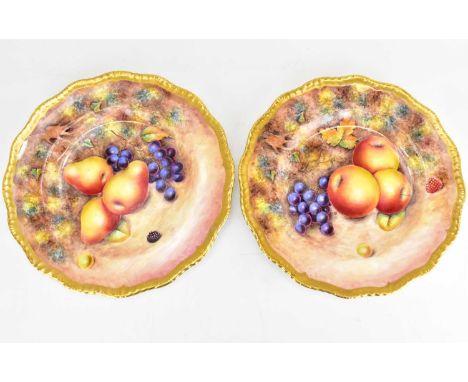 A pair of late 20th century cabinet plates decorated by former Royal Worcester artist G. Delaney, both decorated with fallen 