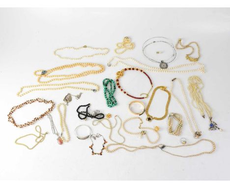 A quantity of costume jewellery to include a rolled gold bangle, various single strands, double strands and other sets of fau