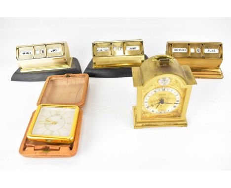 Three matching vintage desk calendars, a small brass cased Swiza clock in the form of a bracket clock, height 9cm, and a smal