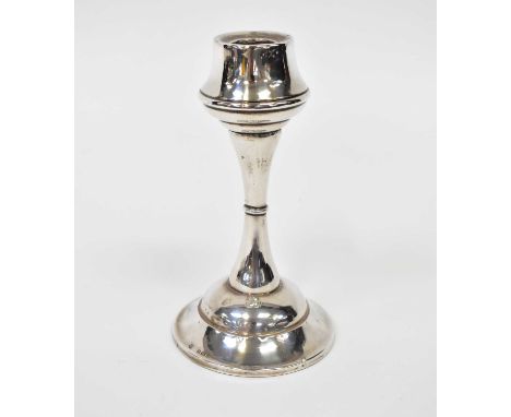 A George V hallmarked silver loaded candlestick, Boots Pure Drug Co, Birmingham 1923, height 17.5cm.