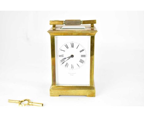 BATTY &amp; SONS, PARIS; a brass cased carriage clock, the white enamelled dial set with Roman numerals, over maker's name, g