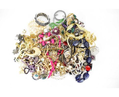 A quantity of mainly modern and vintage costume jewellery to include a 9ct gold dress ring with yellow stones.