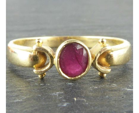 A 14ct gold ring with oval bezel set ruby, with C-shaped shoulders, size Q, approx. 2.5g.Condition Report: Under magnificatio