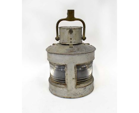 An aluminium ship's lamp stamped GP Ld 1943, with clear lenses, height 35cm.