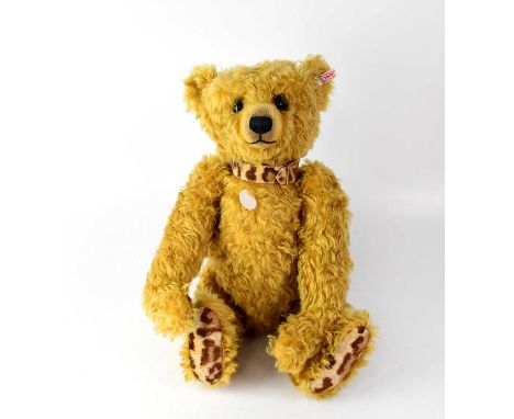 STEIFF; a large 'Desmond' growler bear with leopard print pads and collar, gold button and white tag to ear, height 55cm.