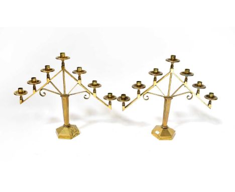 A pair of  seven light candlesticks on hexagonal tapering stems and domed feet, height 46.5cm.