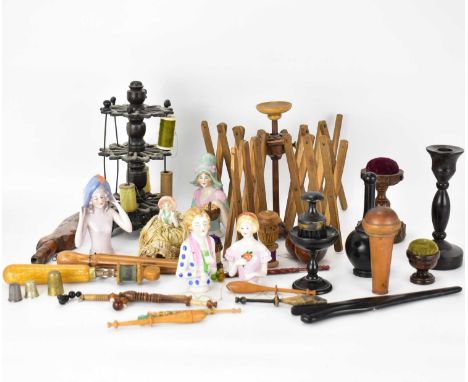 Various sewing and sewing related items to include Victorian cast metal bobbin stand, goose wing, pin cushions, fruitwood tap