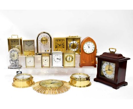 A quantity of modern clocks to include carriage clocks, a Junghans automatic clock, ships' clocks, a Rapport mantel clock, et