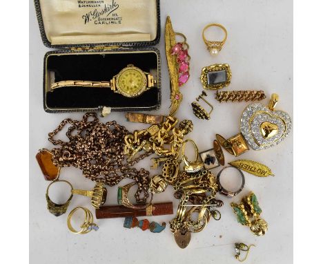 Various items of gold plated jewellery to include charm bracelet, gate bracelet, mourning brooch, garnet cluster and gilt ear