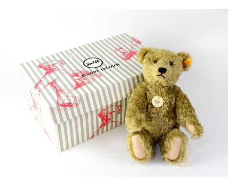 STEIFF; a 'Classic Teddy Bear 1920' copy, with growler, gold button and yellow tag to ear, height 37cm, boxed.