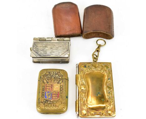 Three vesta cases, comprising a silver plated example of book form, a Victoria Diamond Jubilee example, brass cased, and the 