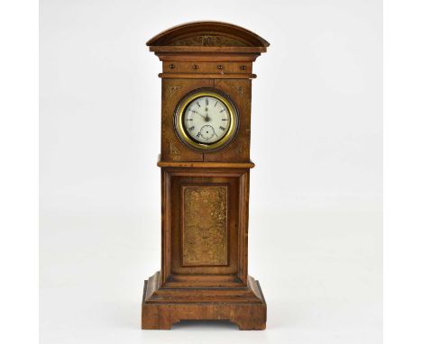 A miniature walnut longcase clock, height 28cm, with floral panel to the front, converted to hold a pocket watch, with silver