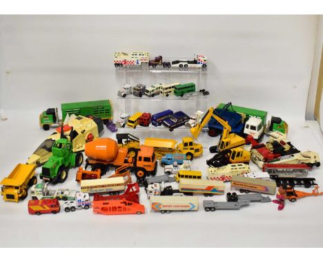 A quantity of playworn Corgi, Dinky and other diecast vehicles, including construction vehicles, wagons, cars, buses, etc and