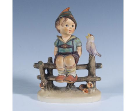 Depicts a boy sitting on a fence with a singing bird. M. I. Hummel inscribed on base. Goebel backstamp. Artist: Reinhold Unge