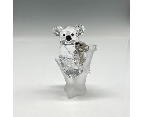 This adorable figural are part of the Rare Encounters group. Mother in clear cut crystal hugging her baby who is designed fro