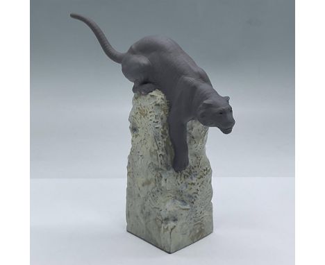 Matte porcelain grey tiger crouches on his base, ready to pounce. Lladro backstamp. This item has its original box. Measures 