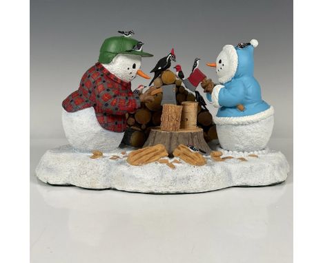 A winteryÂ&nbsp;Christmas tableau figurine of two snowmen chopping wood. Wonderful details, such as the rings of the logs and