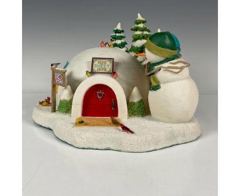 A Holiday tableau figurine of a snowman couple in a loving embrace admiring their new igloo home. Wonderful details, such as 