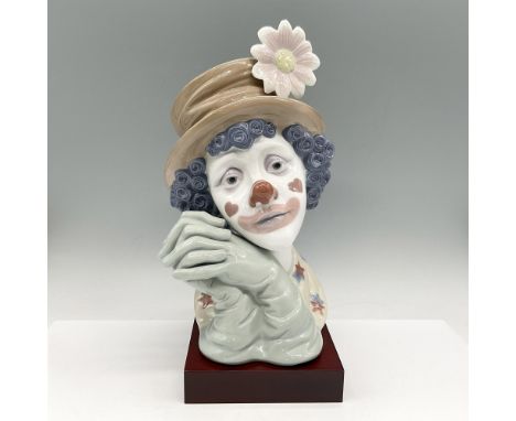 Glossy bust with contemplative clown, colored in brown, white, sage and blue. Lladro backstamp. This item has a base included