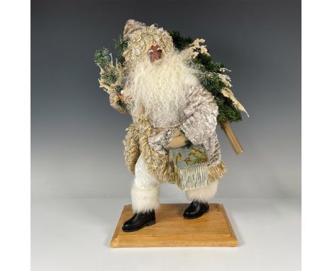 Wonderfully created Santa carrying a tree on his back, tree branches inhabited by white doves and carrying a birdhouse. Dress