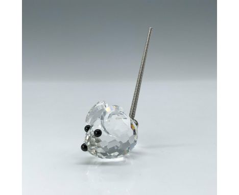 This mouse, a clear crystal figure with black crystal eyes and nose, complemented by a metal spring coil tail, was also an or