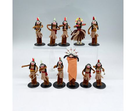 Eleven hand made mini figures made from brown/black pipe cleaners and tan felt. Some figures hold a bow. The tallest is 4.75"