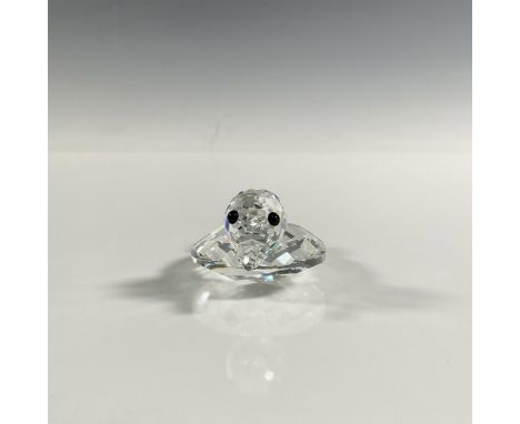 A clear faceted figure of a duck with a wide body and black eyes. Swarovski marking. This item has its original box: 3.5"W x 