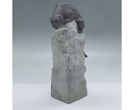 Matte porcelain grey tiger crouching on top of his base. He is alert and watching his prey. Lladro backstamp. This item has i