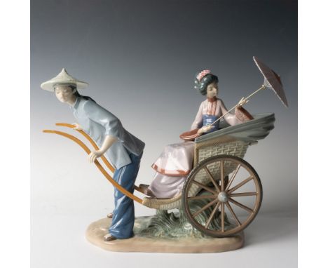 A glossy figure depicting a scene in ancient China of a carrier transporting a woman holding a parasol. Lladro backstamp. Thi