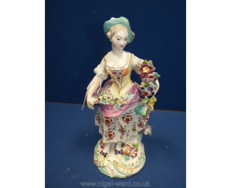 An 18th c. Derby 'patch mark' period (1756-65) figure of a lady flower seller (previously holding a candle sconce, now lackin
