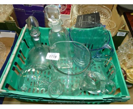 Three decanters including bulbous smoky glass with crest engraving together with jugs, one with 'R.E.' Royal Monmouth engravi