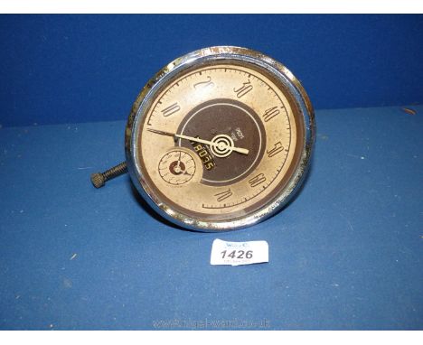 A vintage Smiths 5'' 70 MPH speedometer with integral odometer and clock.