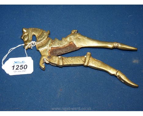 An old Indian Deccani brass and iron betel nut cracker in the form of a prancing horse, heavy wear to the metal and extensive