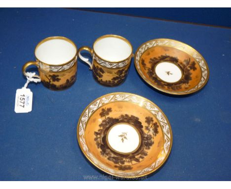 A pair of porcelain fond brun goblets litron, First Empire before 1811, each individually painted with a silhouette landscape
