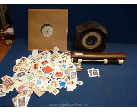 A Smiths bakelite clock, no key, and a cased recorder and miscellaneous stamps etc.