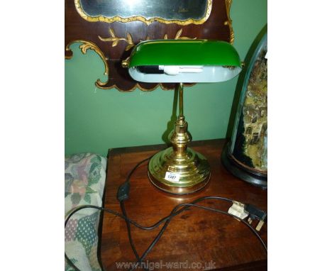 A Brass Banker's Lamp with green glass shade, 14" tall overall.