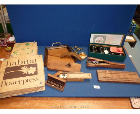 A quantity of miscellanea including flower presses, indoor carpet bowls, Dominoes and dice, tripod, onyx swan, cribbage board