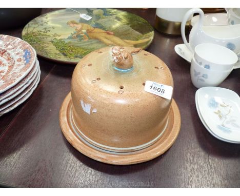 A Studio Pottery cheese dome with finial of mouse eating cheese.