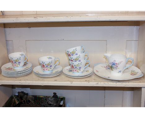 A Shelley Wild Flowers pattern porcelain part tea service comprising platter, milk jug, five teacups and saucers and six cake