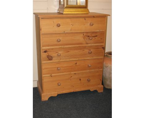 A pine chest of five drawers on shaped bracket feet, 80cm