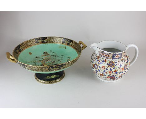 A Carltonware chinoiserie dish on pedestal base, decorated in gilt and black on green ground, 26cm diameter, (a/f - damage to