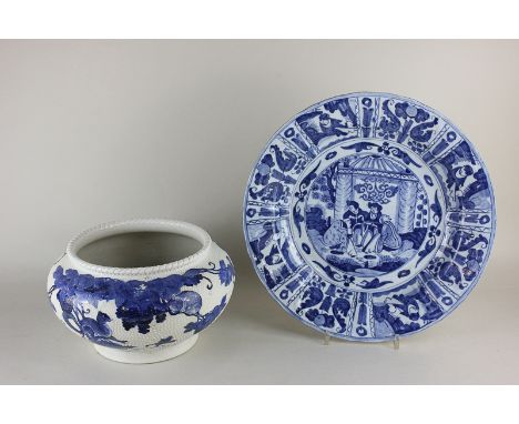 A blue and white Chinese porcelain charger depicting figures in a landscape, 32cm diameter, together with a Chinese blue and 