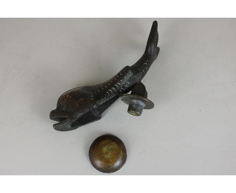 A brass dolphin door knocker, 20cm