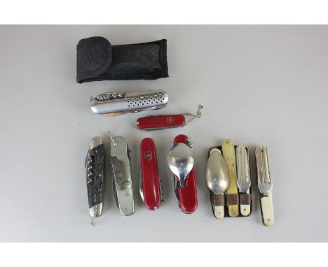 A collection of six penknives, including two Swiss Army, together with a folding knife, fork and spoon set, and a folding for