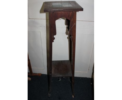 An Edwardian jardiniere stand, square top with two-tone coloured four-tile inset, 105cm high